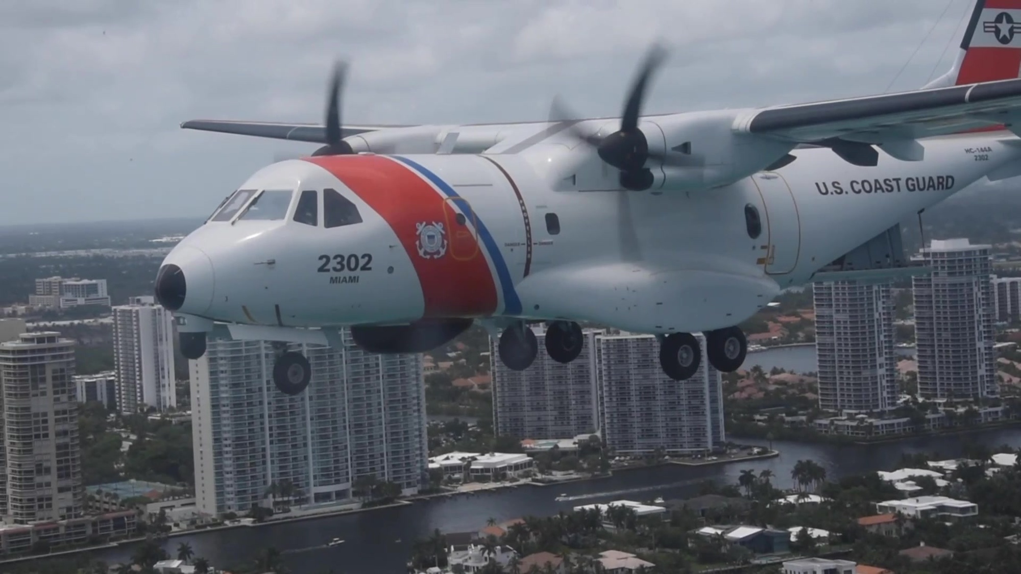 A Coast Guard Air Station Miami HC-144 Ocean Sentry airplane crew conducts an Honor Flight over Miami, Florida, May 23, 2020. The Honor Flight celebrates first responders and medical staff working diligently during the COVID-19 pandemic. Coast Guard Video by Petty Officer 3rd Class Brandon Murray.