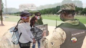 DC Guardsman speak to DC residents on the Mall