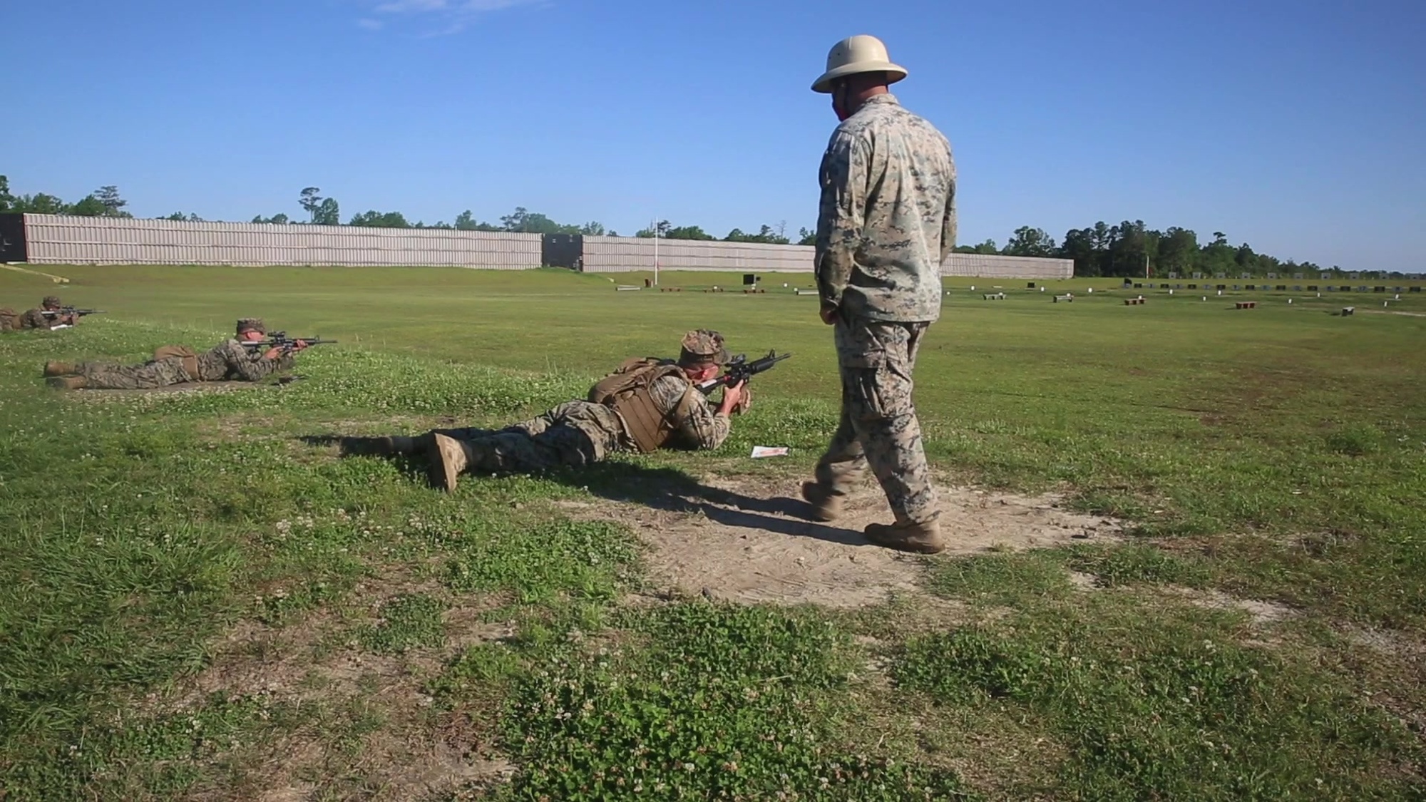 U.S. Marines, range and armory personnel adhere to COVID-19 guidelines in order to slow and halt the spread of COVID-19 on Stone Bay, Marine Corps Base Camp Lejeune North Carolina, June 2, 2020. In order to sustain combat proficiency for mission readiness during the COVID-19 outbreak, rifle ranges have incorporated social distancing and the use of preventative masks in their operations. (U.S. Marine Corps video by Cpl. Evan Falls)