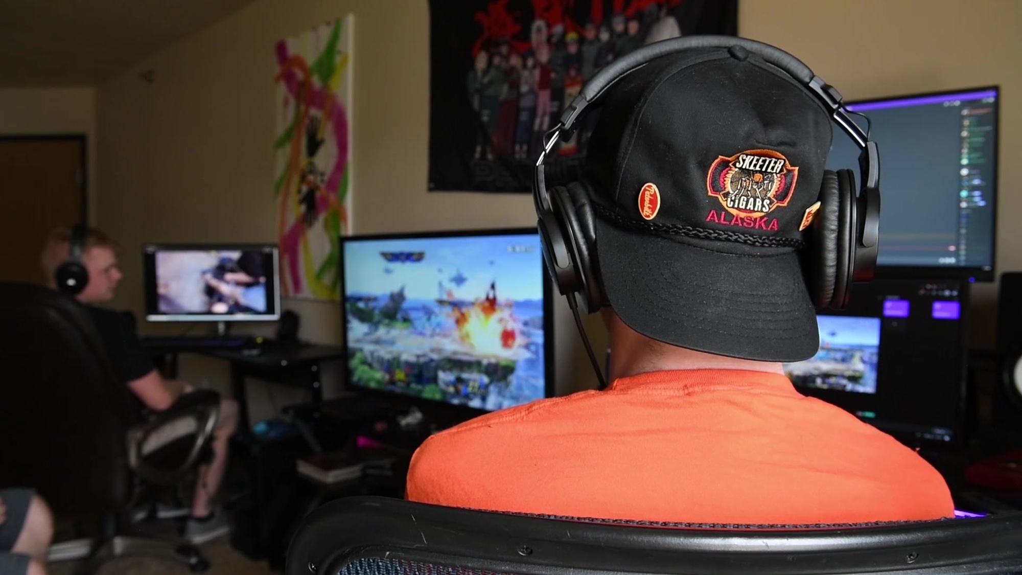 Senior Airman Zane Smith, 5th Force Support Squadron evaluations technician, explains a gaming tournament he hosted in Minot, North Dakota, May 23, 2020.