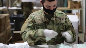 Washington National Guard packs COVID-19 test kits