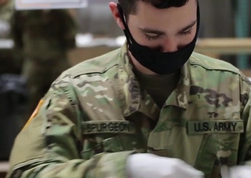 Washington National Guard packs COVID-19 test kits