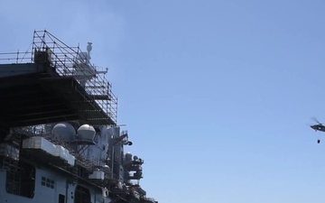 Sailors and Federal San Diego Firefighters fight fire aboard USS Bonhomme Richard