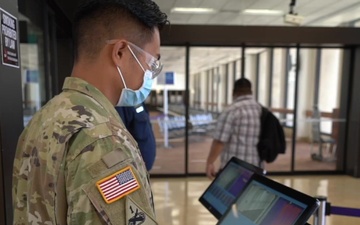 Hawaii National Guardsmen transition to thermal imaging to screen incoming passengers at Daniel K. Inouye International Airport.