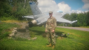 Senior Airman Charles Churchill sings God Bless America