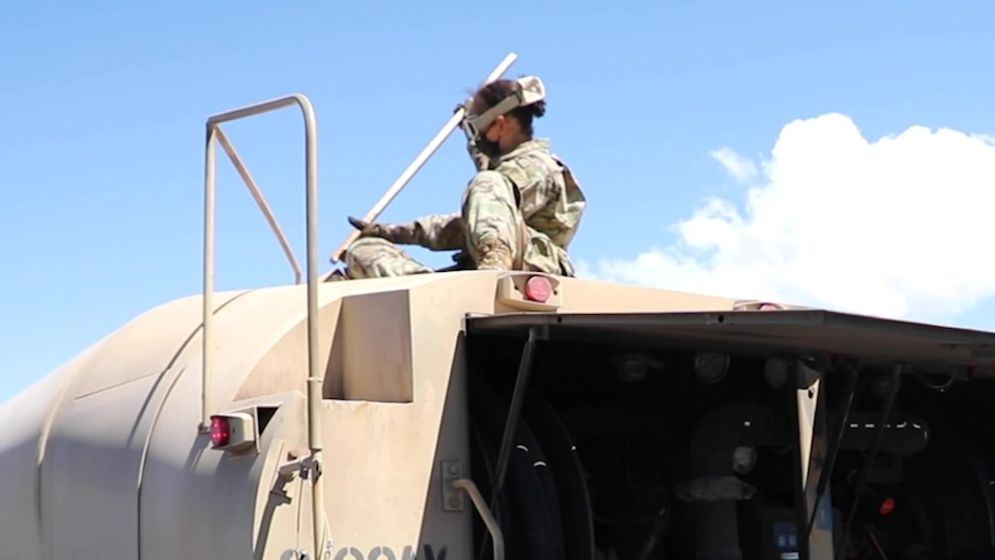 Sgt. Corey Flynn, senior medic and 1st. Lt. Bivor Shrestha, an aeromedical physician assistant assigned to 2nd Squadron, 6th Cavalry, 25th Combat Aviation Brigade, 25th Infantry Division, explain the COVID-19 mitigation measures for the Soldier&#39;s inter-island travel from Wheeler Army Airfield to Pohakuloa Training Area, Island of Hawaii, for aerial gunnery training during the month of August. (U.S. Army video by Sgt. Sarah D. Sangster)