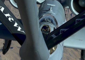 A U.S. Air Force KC-135 Stratotanker refuels A-10 Thunderbolts.