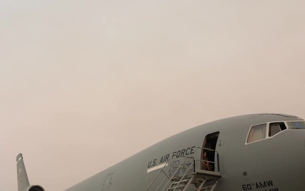 KC-10s, smoke on the flight line