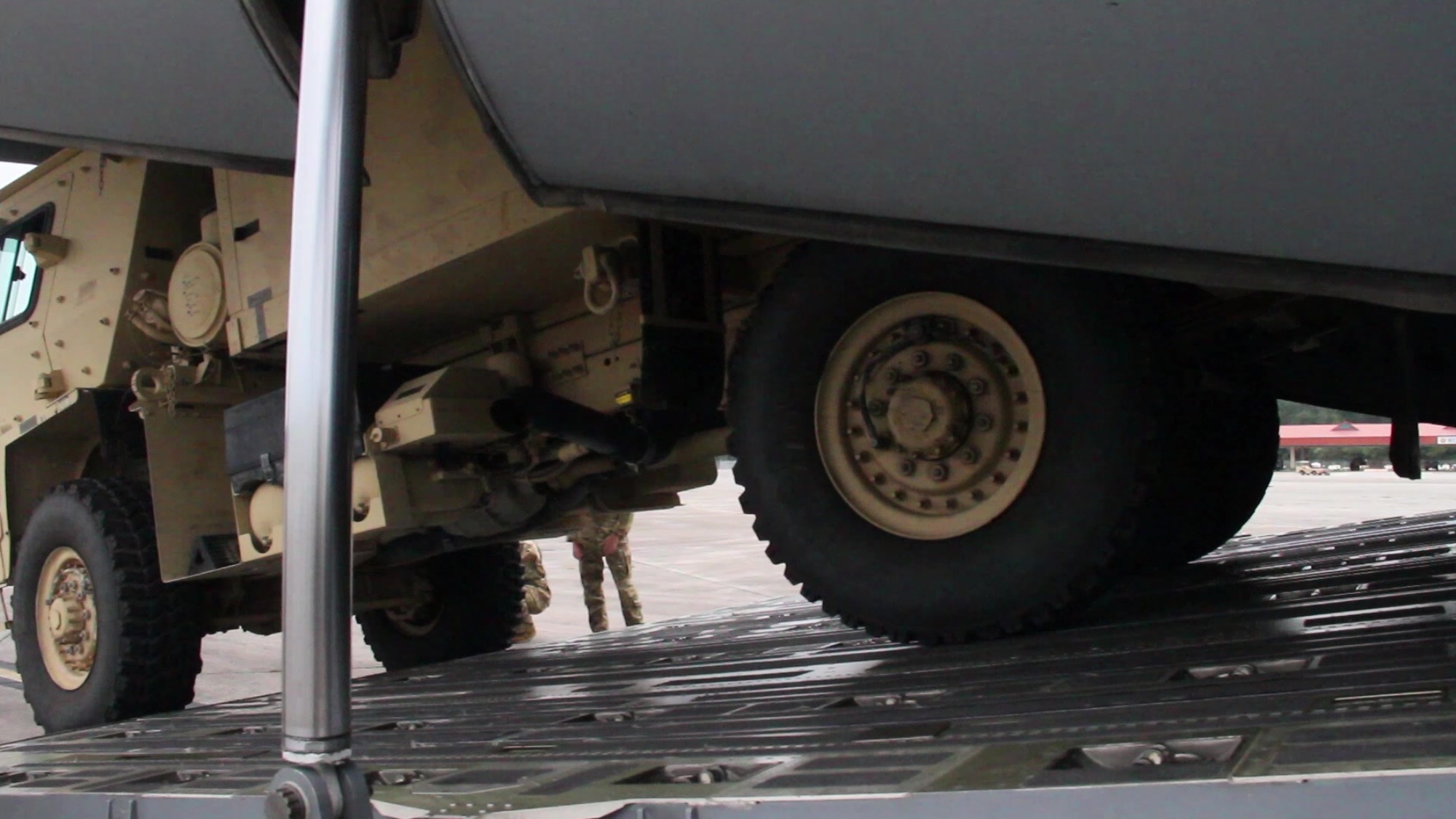 U.S. Air Force loadmaster instructors who are assigned to the 9th Airlift Squadron, 436th Airlift Wing, Air Mobility Command, based at Dover Air Force Base, Del., give guidance to Army Soldiers on how to load vehicles and aircraft onto a C-5 Galaxy and a C-17 Globemaster III, at Hunter Army Airfield, Ga., Oct. 6, 2020. Soldiers gained experience by loading and unloading an M1079A Light Medium Tactical Vehicle Van to improve joint operability among branches. (U.S. Army video by Pfc. Aaliyah Craven)