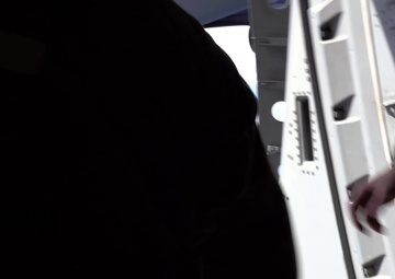 C-17 Globemaster III Airdrops Payload To USS Henry M. Jackson