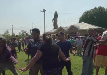 Hondurans participate in unloading life-saving supplies