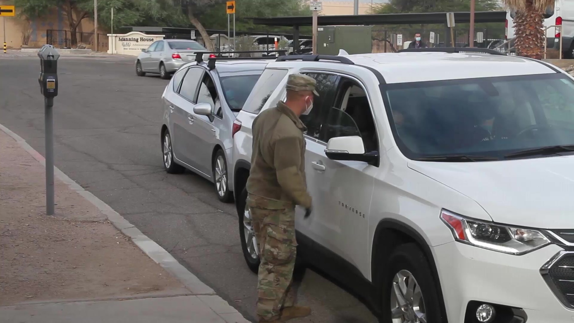 Arizona National Guard service members direct visitor check-in at a COVID-19 testing site at the Arizona Department of Administration in Tucson, Ariz., Nov. 12, 2020. The Arizona National Guard is continuing to support COVID-19 testing statewide.(U.S. Army National Guard photo by Spc. Thurman Snyder)