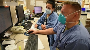 U.S. Air Force nurses with the 62nd Medial Brigade work at Sanford Health Bismarck, Bismarck, N.D., Nov. 30, 2020.