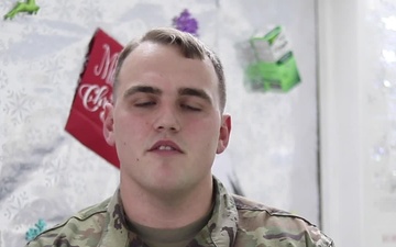 Spc. Dathan Sanchez, Copperas Cove, TX, delivers a Christmas message