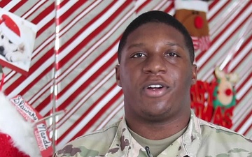 Spc. J'Veion Johnson, Miami, FL, delivers a Christmas message