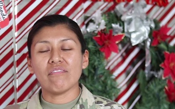 Sgt. 1st Class Joanne Delacruz, Hartford, CT, delivers a Christmas message