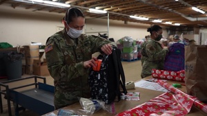 The Alaska National Guard safely prepares Christmas gifts for three remote villages for Operation Santa Claus