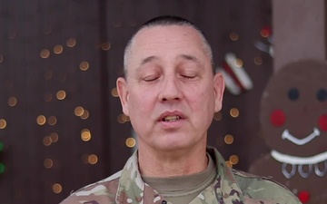 1st Sgt. Brian Whitead, Sioux City, IA, delivers a Christmas message