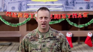 1st Sgt. Luke Krier, Remsen, IA, delivers a Christmas message