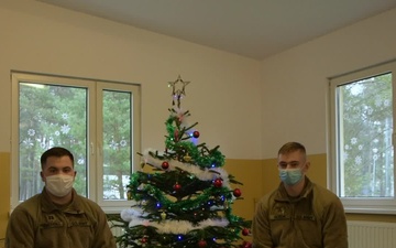 Alaska Army National Guard Capt. Maxwell Severance and Sgt. Ryan Hickok 297th Regional Support Group wish their family a Merry Christmas from Poland.