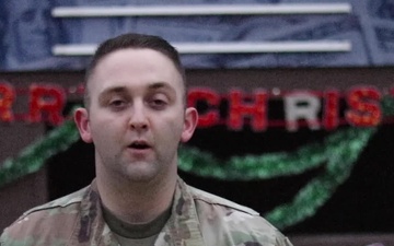 1st Lt. Nate Hoeger, Chariton, IA, delivers a Christmas message