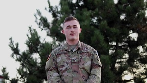 Pfc. Dominique Hollowell, Sergeant Bluff, IA, delivers a Christmas message