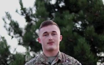 Pfc. Dominique Hollowell, Sergeant Bluff, IA, delivers a Christmas message