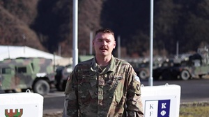 Pfc. Gabe Tedrow, Cantril, IA, delivers a Christmas message