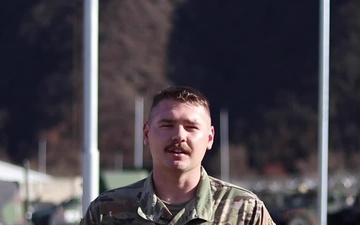 Pfc. Gabe Tedrow, Cantril, IA, delivers a Christmas message