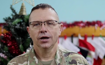 Command Sgt. Maj. William Adams, Norwalk, IA, delivers a Christmas message