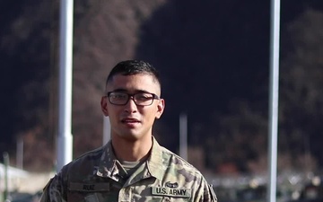 Spc. Oscar Ruiz, Des Moines, IA, delivers a Christmas message