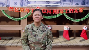Staff Sgt. Angel Phompong, Webster City, IA, delivers a Christmas message