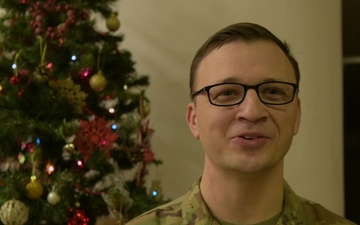 Alaska Army National Guard Lt. Chris Frolander wishes his wife and kids a Merry Christmas.