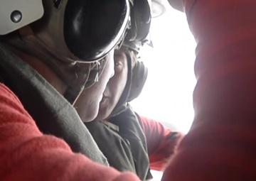 Sailor Reenlists aboard a Helicopter