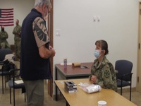 Arizona National Guard members train retired medical professionals on Moderna vaccine immunization.