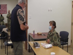 Arizona National Guard members train retired medical professionals on Moderna vaccine immunization.