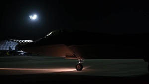 Joint Base Langley-Eustis maintainers direct and receive jets during night operations