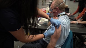 Staff workers at the Javits NY vaccination site receive the vaccine