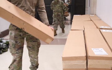 National Guard distributes cots