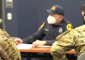 Hawaii National Guard Soldiers meet with Virginia State Police to finalize traffic security operations during the 59th Presidential Inauguration