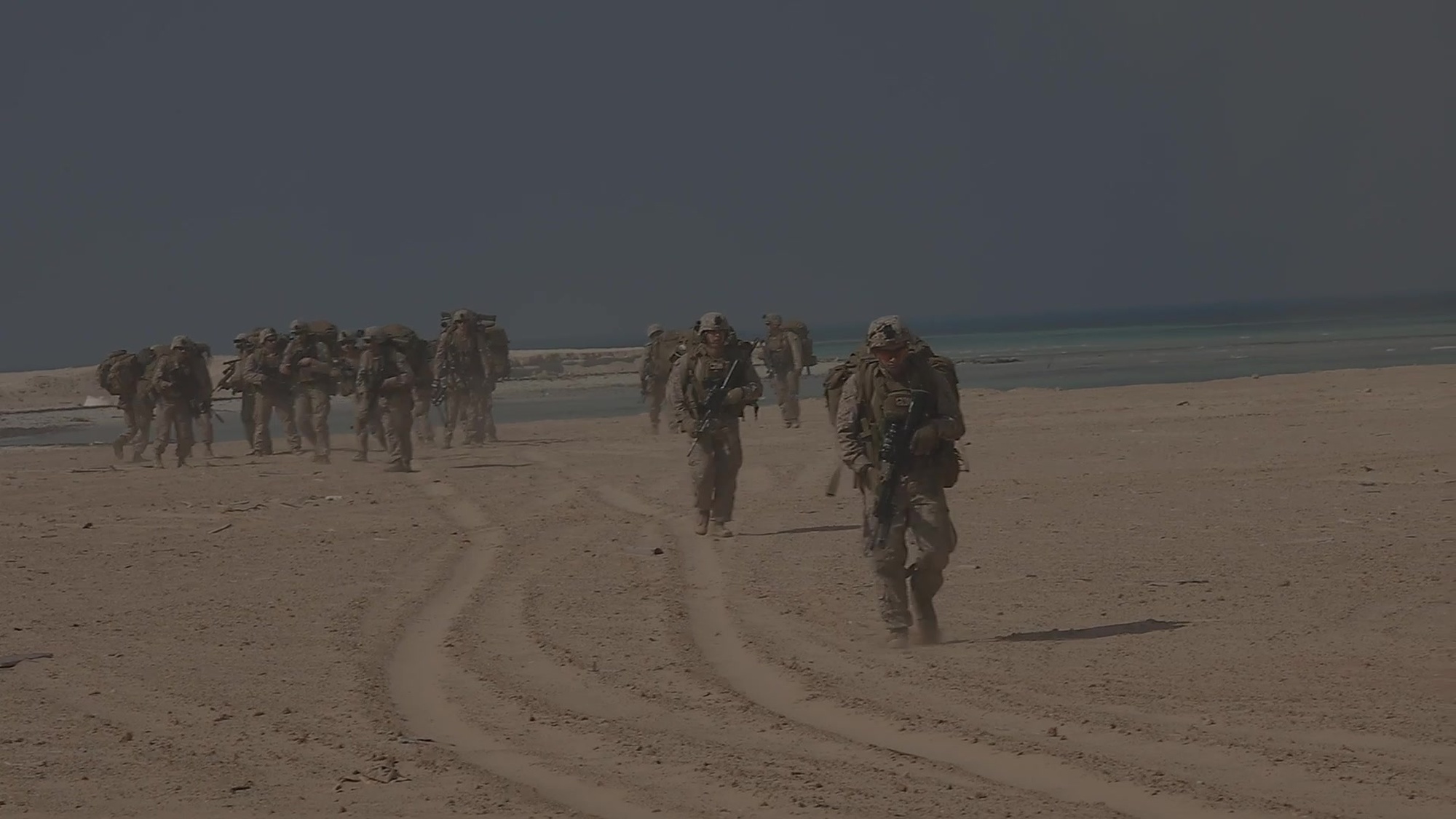 A United Arab Emirate Presidential Guardsman and U.S. Marines engage in a crisis response exercise in the UAE, Jan. 13, 2021. The regularly scheduled exercise was designed to sustain proficiency and enhance MAGTF integration in a realistic training environment. The Special Purpose Marine Air-Ground Task Force – Crisis Response – Central Command is a crisis response force, prepared to deploy a variety of capabilities across<br />the region. (U.S. Marine Corps photo by Cpl. Robert Kuehn)