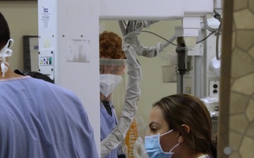 U.S. Air Force medic assists nurses in California hospital’s trauma department