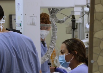 U.S. Air Force medic assists nurses in California hospital’s trauma department