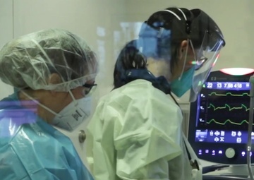 Service member provides care for COVID patients at a Los Angeles County University of Southern California Medical Center Intensive Care Unit