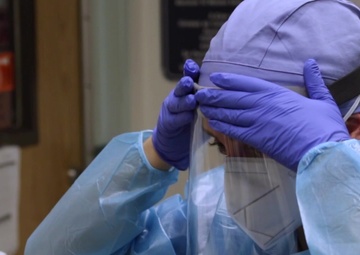 U.S. Air Force Clinical Nurse assists medical personnel at Harbor-UCLA Medical Center