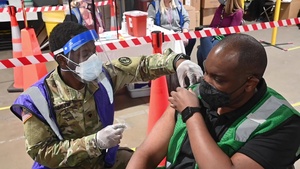 The Maryland National Guard assists with COVID-19 vaccinations at the Maryland State Fairgrounds.