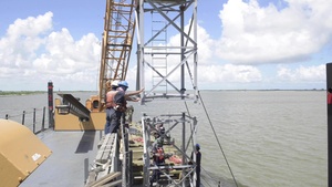 Coast Guard Cutter Pamlico works aids to navigation on the Mississippi River