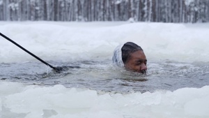 UK troops take the plunge into icy water in freezing conditions