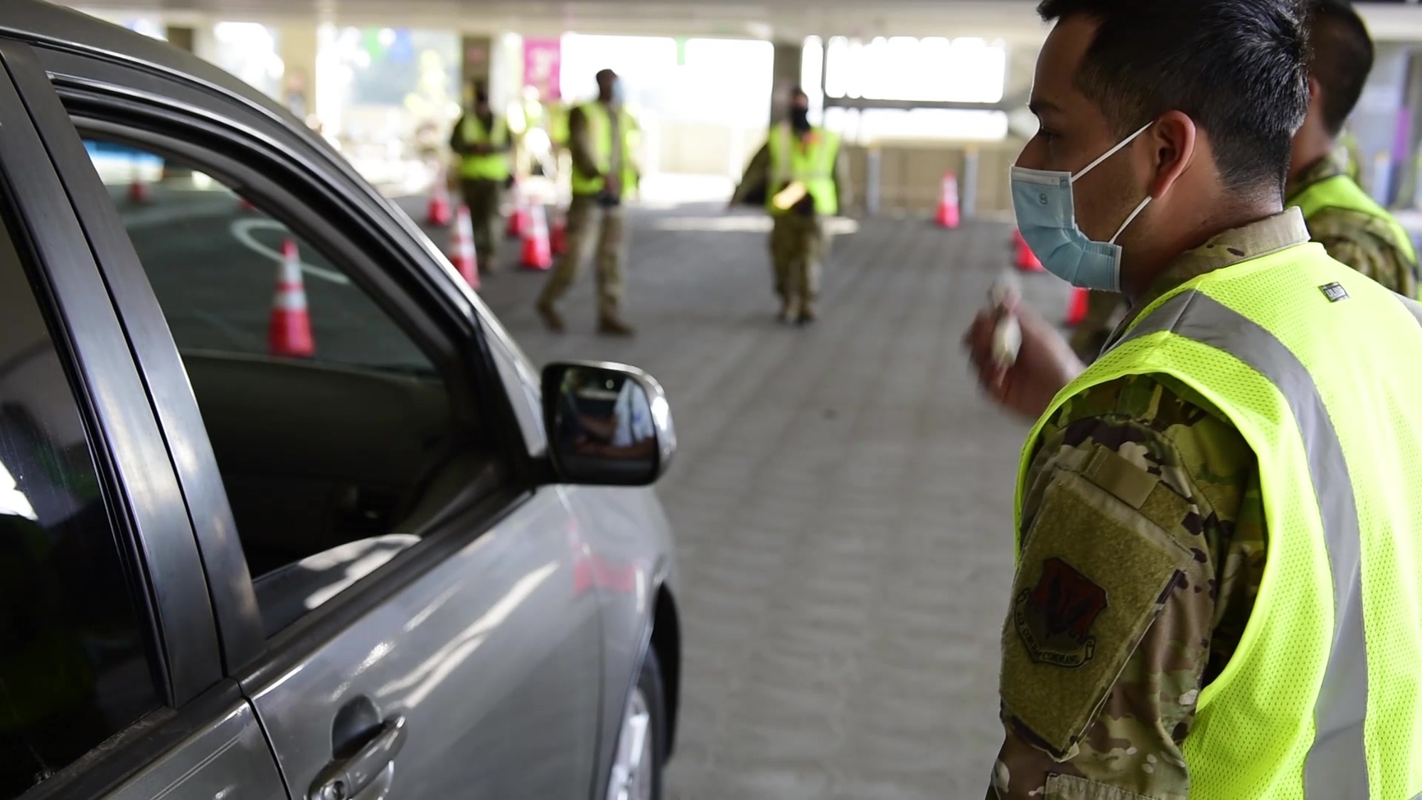U.S. Air Force Airmen with the 195th Wing, California Air National Guard, check customers in at the drive-thru site of the COVID-19 community vaccination center at California State University, Los Angeles, Feb. 20, 2021. Medical screening questions are asked at check in to ensure the customer’s fitness for taking the vaccine. Airmen in order of appearance: Airman 1st Class Daniel Aguirre, Staff Sgt. Matthew Herrera, Tech. Sgt. Christopher Cardoza, and Airman 1st Class David Eggers. (U.S. Air National Guard video by Senior Airman Neil Mabini)