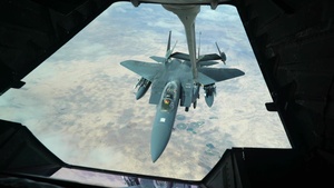 KC-10 Extender refuels F-15E Strike Eagles